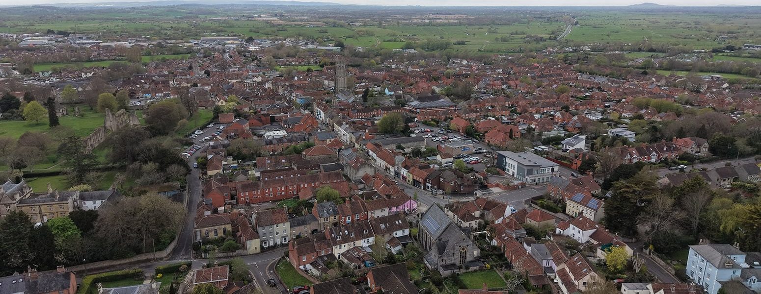 Glastonbury town in Somerset UK drone aerial  high angle